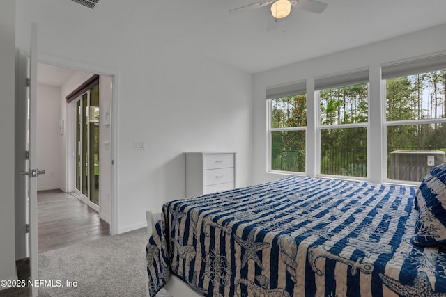 564 Jubilee Cir, Yulee, FL 32097 - carpeted bedroom with baseboards and ceiling fan