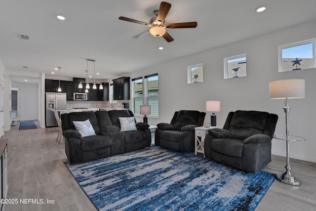 564 Jubilee Cir, Yulee, FL 32097 - living room featuring a ceiling fan, light wood-style flooring, and recessed lighting