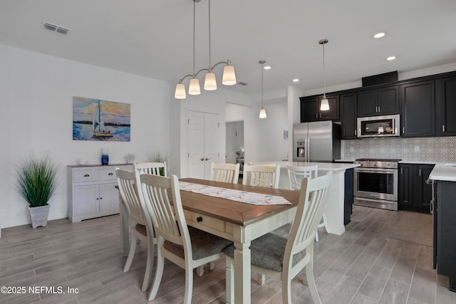 564 Jubilee Cir, Yulee, FL 32097 - dining space featuring wood tiled floors and recessed lighting