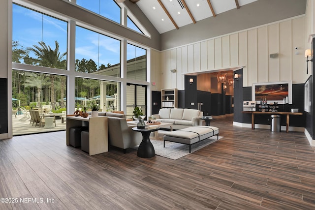 564 Jubilee Cir, Yulee, FL 32097 - living room featuring high vaulted ceiling, beam ceiling, wood finished floors, and a chandelier