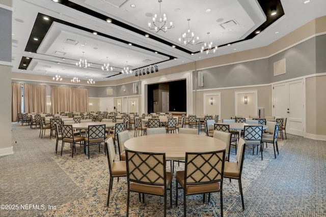 564 Jubilee Cir, Yulee, FL 32097 - carpeted dining area with a chandelier and a high ceiling
