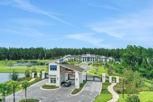 564 Jubilee Cir, Yulee, FL 32097 - view of home's community with a gate, a water view, and a view of trees