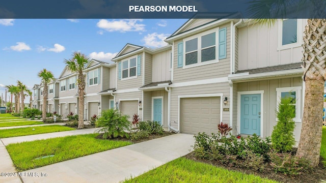 1542 Jeremiah St, Middleburg, FL 32068 - townhome / multi-family property featuring board and batten siding, concrete driveway, a residential view, and a garage