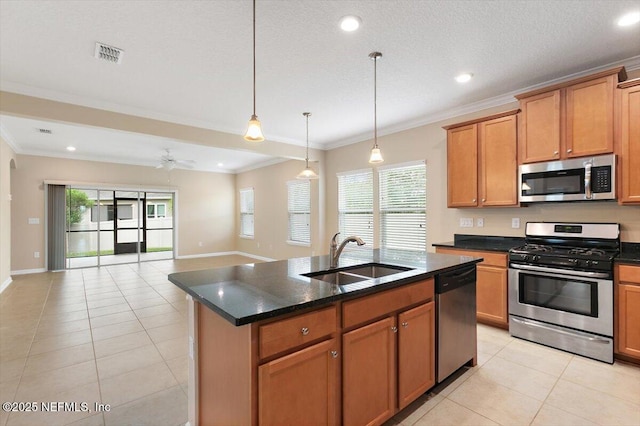 165 Crown Colony Rd, Saint Augustine, FL 32092 - kitchen featuring appliances with stainless steel finishes, a sink, light tile patterned flooring, healthy amount of natural light, and ornamental molding