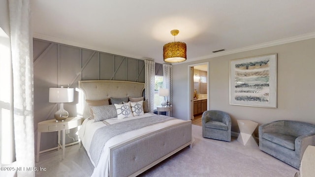 527 Superior Blvd, Saint Johns, FL 32092 - bedroom with ornamental molding, light carpet, and connected bathroom