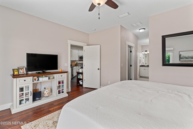6228 Blue Marlin Dr, Keystone Heights, FL 32656 - bedroom featuring dark wood-style flooring, ensuite bath, and ceiling fan