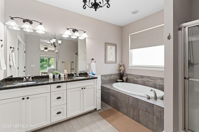 6228 Blue Marlin Dr, Keystone Heights, FL 32656 - bathroom with double vanity, a bath, a stall shower, and a chandelier