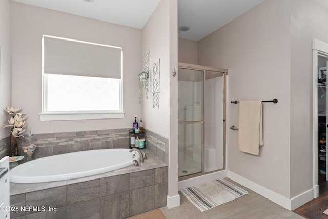6228 Blue Marlin Dr, Keystone Heights, FL 32656 - full bath with a shower stall, a spacious closet, and a garden tub