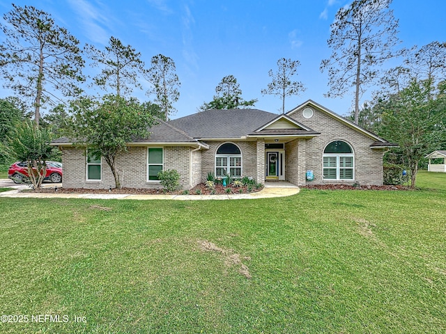 3923 Eden Estate Trl, Middleburg, FL 32068 - single story home featuring a front yard and brick siding