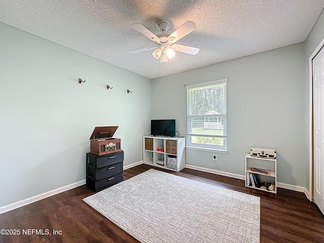 3923 Eden Estate Trl, Middleburg, FL 32068 - bedroom featuring dark wood finished floors, baseboards, a textured ceiling, and a ceiling fan