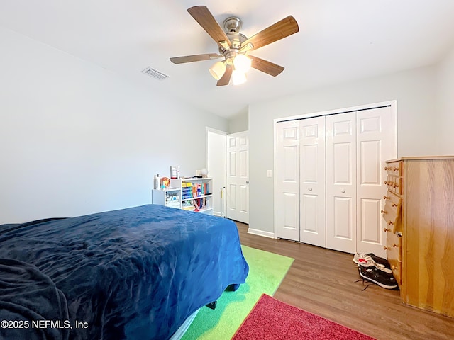 3923 Eden Estate Trl, Middleburg, FL 32068 - bedroom featuring wood finished floors, ceiling fan, and a closet