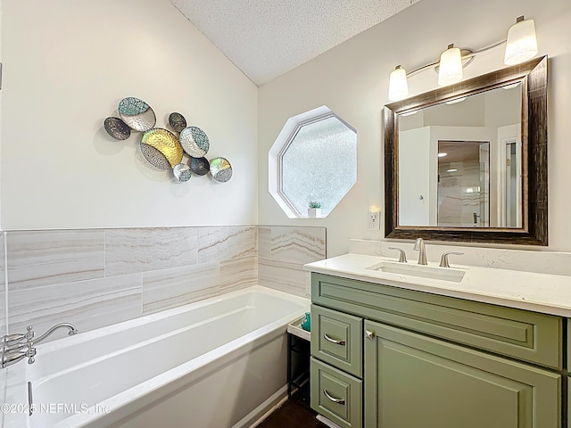3923 Eden Estate Trl, Middleburg, FL 32068 - full bath featuring vanity, a garden tub, a textured ceiling, and lofted ceiling