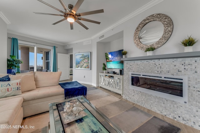 1925 S Atlantic Ave Unit 810, Daytona Beach Shores, FL 32118 - living area featuring wood finished floors, crown molding, a ceiling fan, baseboards, and a tile fireplace