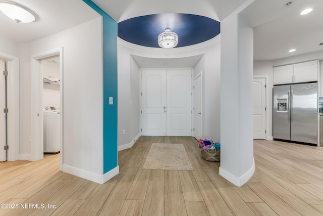 1925 S Atlantic Ave Unit 810, Daytona Beach Shores, FL 32118 - entryway with light wood-style floors, washer / clothes dryer, baseboards, and recessed lighting