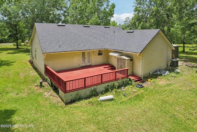 2443 SE 150th St, Starke, FL 32091 - rear view of house with a wooden deck, a shingled roof, and a lawn