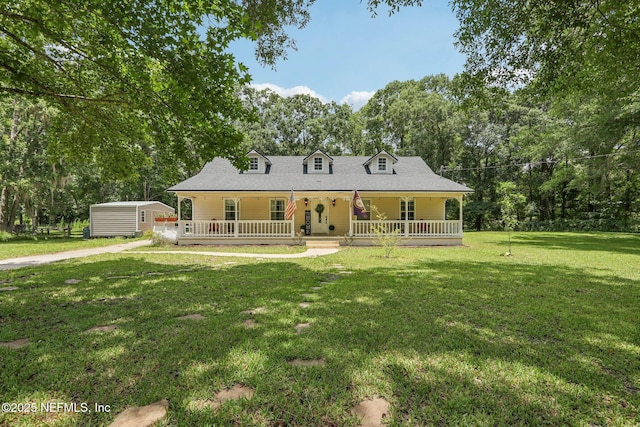 2443 SE 150th St, Starke, FL 32091 - rear view of house featuring a porch, a lawn, a shed, and view of wooded area