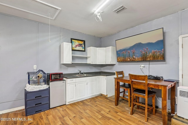 2443 SE 150th St, Starke, FL 32091 - home office featuring attic access and light wood-type flooring