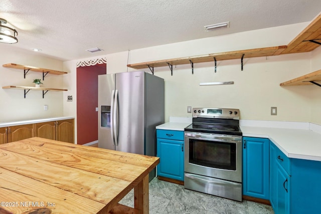 2443 SE 150th St, Starke, FL 32091 - kitchen featuring blue cabinetry, appliances with stainless steel finishes, open shelves, and a textured ceiling