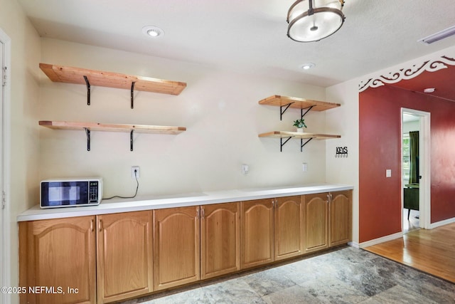 2443 SE 150th St, Starke, FL 32091 - bar area with baseboards and light wood-style flooring