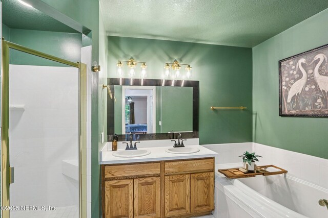 2443 SE 150th St, Starke, FL 32091 - ensuite bathroom with a textured ceiling, a bath, a shower stall, and double vanity