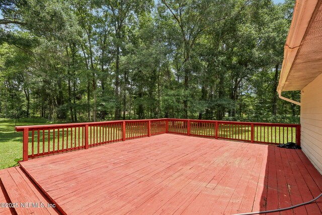 2443 SE 150th St, Starke, FL 32091 - wooden deck with view of wooded area