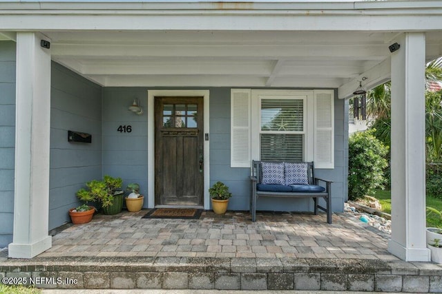 416 Margaret St, Neptune Beach, FL 32266 - view of exterior entry featuring a porch