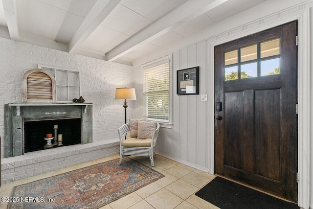 416 Margaret St, Neptune Beach, FL 32266 - entrance foyer featuring tile patterned flooring, beamed ceiling, and a fireplace