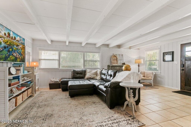 416 Margaret St, Neptune Beach, FL 32266 - living room with healthy amount of natural light, beamed ceiling, tile patterned floors, and baseboards