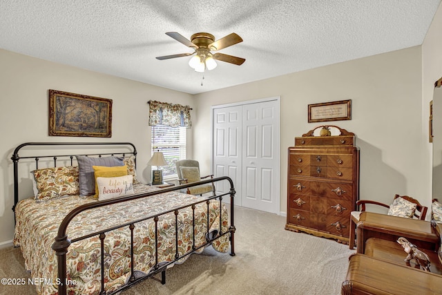 5365 Navigators Way, Jacksonville, FL 32277 - bedroom featuring carpet floors, a closet, ceiling fan, and a textured ceiling