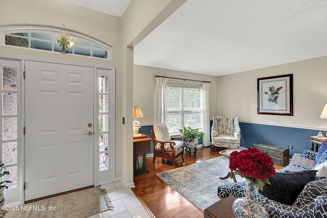 5365 Navigators Way, Jacksonville, FL 32277 - tiled foyer entrance with a textured ceiling and baseboards