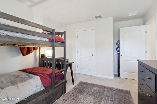 14 Rambling Ln, Palm Coast, FL 32164 - bedroom with light colored carpet and baseboards