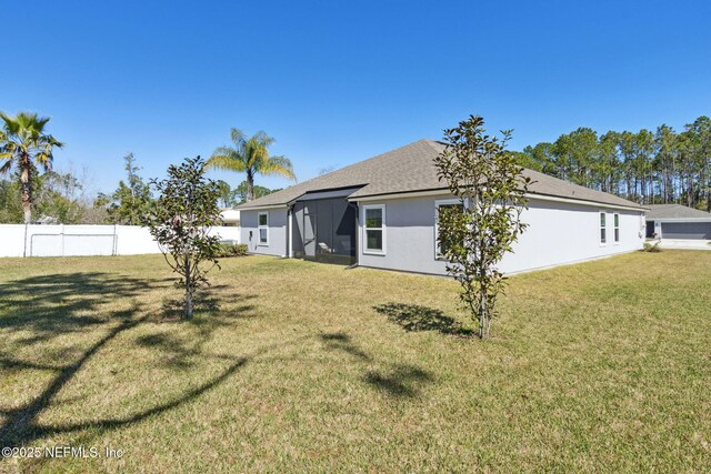 14 Rambling Ln, Palm Coast, FL 32164 - back of property with roof with shingles and stucco siding