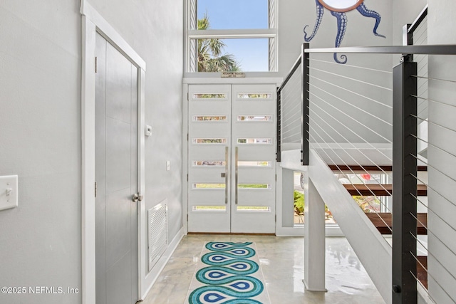 248 11th St, Atlantic Beach, FL 32233 - entryway with baseboards and concrete flooring