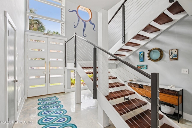 248 11th St, Atlantic Beach, FL 32233 - staircase with a towering ceiling