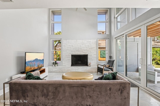 248 11th St, Atlantic Beach, FL 32233 - living area with a high ceiling and a brick fireplace