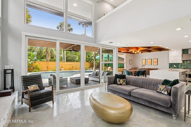 248 11th St, Atlantic Beach, FL 32233 - living room featuring plenty of natural light, recessed lighting, and a towering ceiling