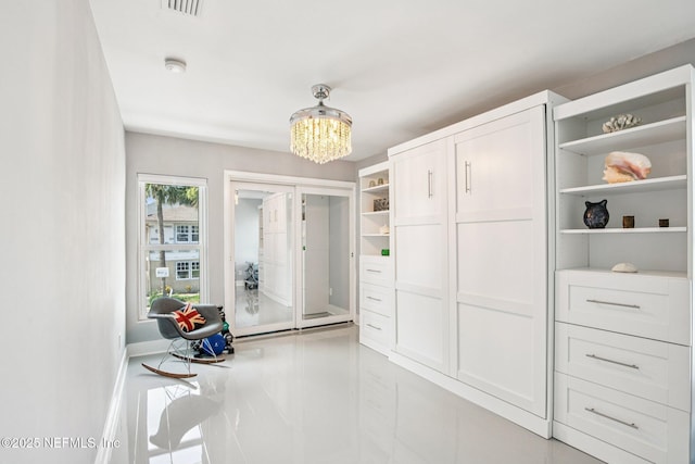 248 11th St, Atlantic Beach, FL 32233 - spacious closet featuring a chandelier and light tile patterned floors