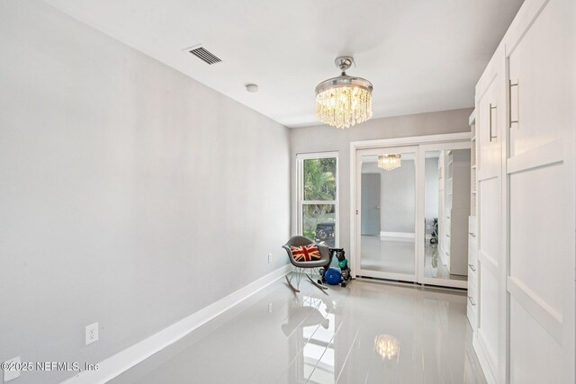 248 11th St, Atlantic Beach, FL 32233 - bathroom with a chandelier and tile patterned flooring