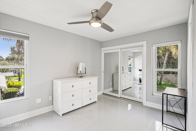 248 11th St, Atlantic Beach, FL 32233 - bedroom with light tile patterned floors, a closet, and a ceiling fan