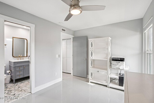 248 11th St, Atlantic Beach, FL 32233 - kitchen with gray cabinetry, a ceiling fan, and tile patterned floors
