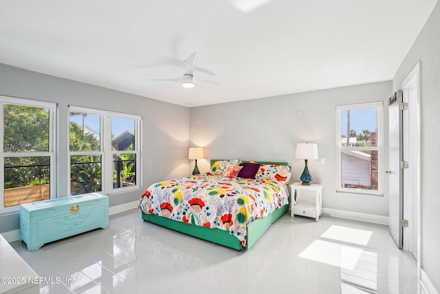 248 11th St, Atlantic Beach, FL 32233 - tiled bedroom with baseboards and a ceiling fan