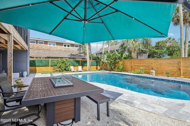 248 11th St, Atlantic Beach, FL 32233 - view of pool featuring a patio area, a fenced backyard, and outdoor dining space