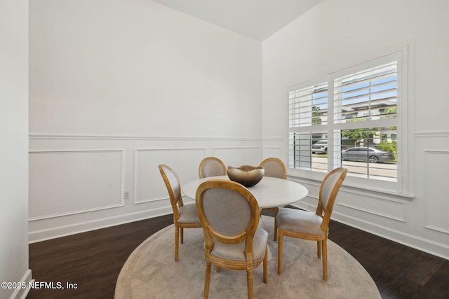 97 Marquesa Cir, Saint Johns, FL 32259 - dining space featuring a decorative wall, dark wood-type flooring, and wainscoting