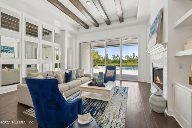 97 Marquesa Cir, Saint Johns, FL 32259 - living room with a lit fireplace, beamed ceiling, and dark wood finished floors