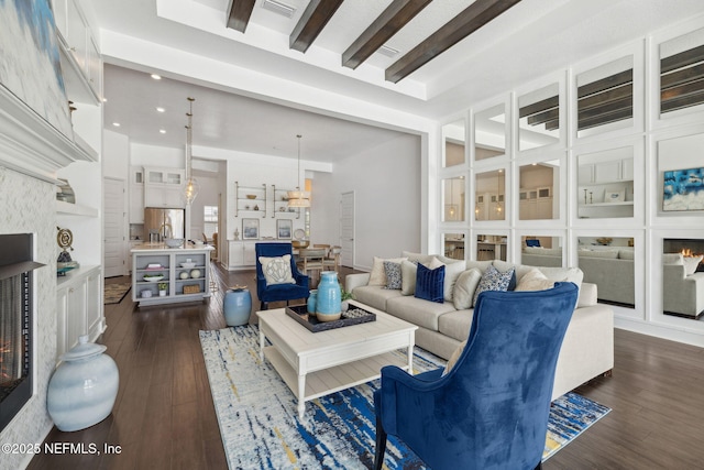 97 Marquesa Cir, Saint Johns, FL 32259 - living area featuring a lit fireplace, dark wood-style flooring, beam ceiling, and recessed lighting