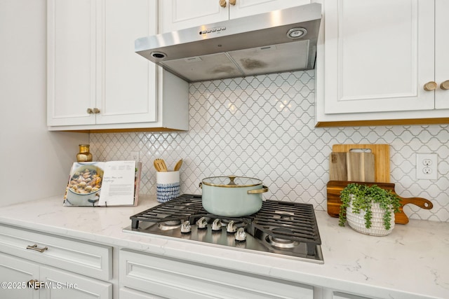 97 Marquesa Cir, Saint Johns, FL 32259 - kitchen featuring under cabinet range hood, stainless steel gas stovetop, white cabinetry, and backsplash