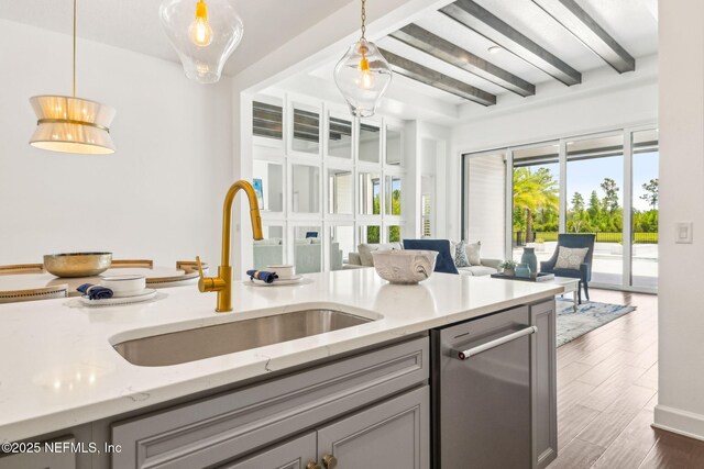 97 Marquesa Cir, Saint Johns, FL 32259 - kitchen with dishwasher, open floor plan, beamed ceiling, gray cabinets, and pendant lighting