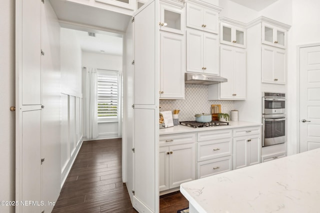 97 Marquesa Cir, Saint Johns, FL 32259 - kitchen with appliances with stainless steel finishes, backsplash, white cabinets, and glass insert cabinets