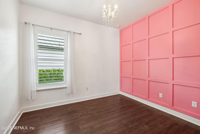97 Marquesa Cir, Saint Johns, FL 32259 - spare room featuring a chandelier and dark wood-type flooring