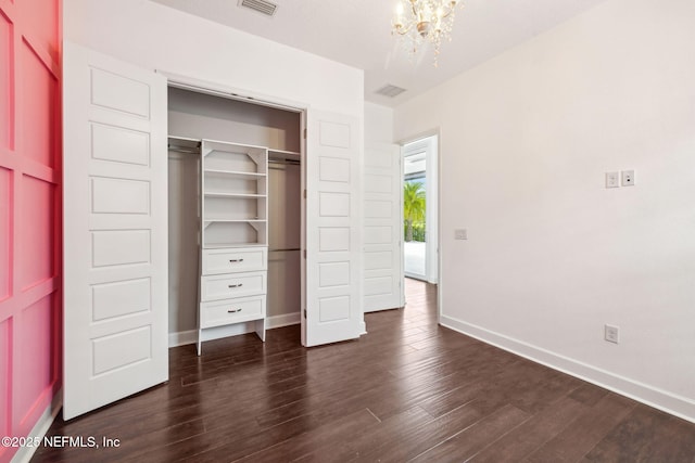 97 Marquesa Cir, Saint Johns, FL 32259 - unfurnished bedroom featuring a chandelier, dark wood-style floors, and a closet